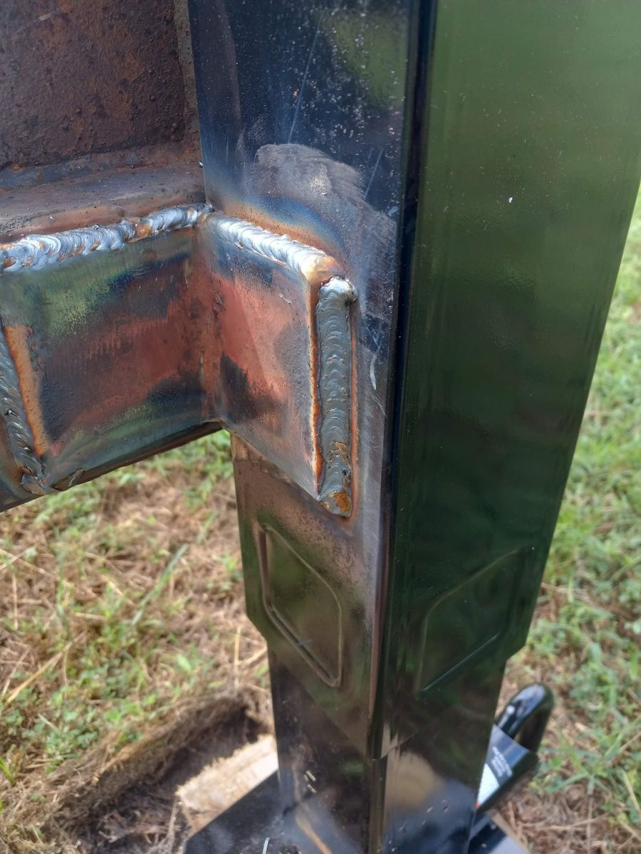 Close-up of a welded steel post joint